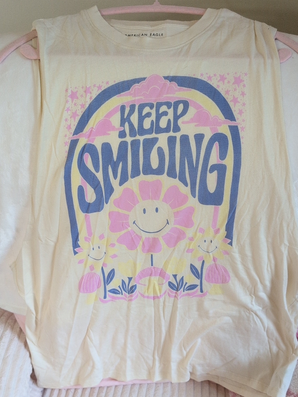 American Eagle Outfitters Cream Tee with Pink & Blue Smiley Flower Graphic